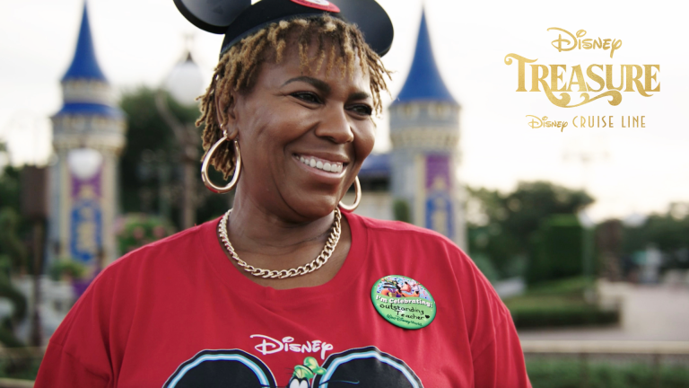 Jackie Russell smiles in front of Cinderella Castle